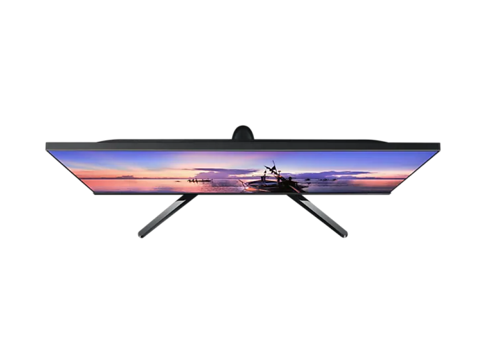 Un monitor de ordenador, visto desde arriba, muestra una puesta de sol sobre el agua y un marco negro.
