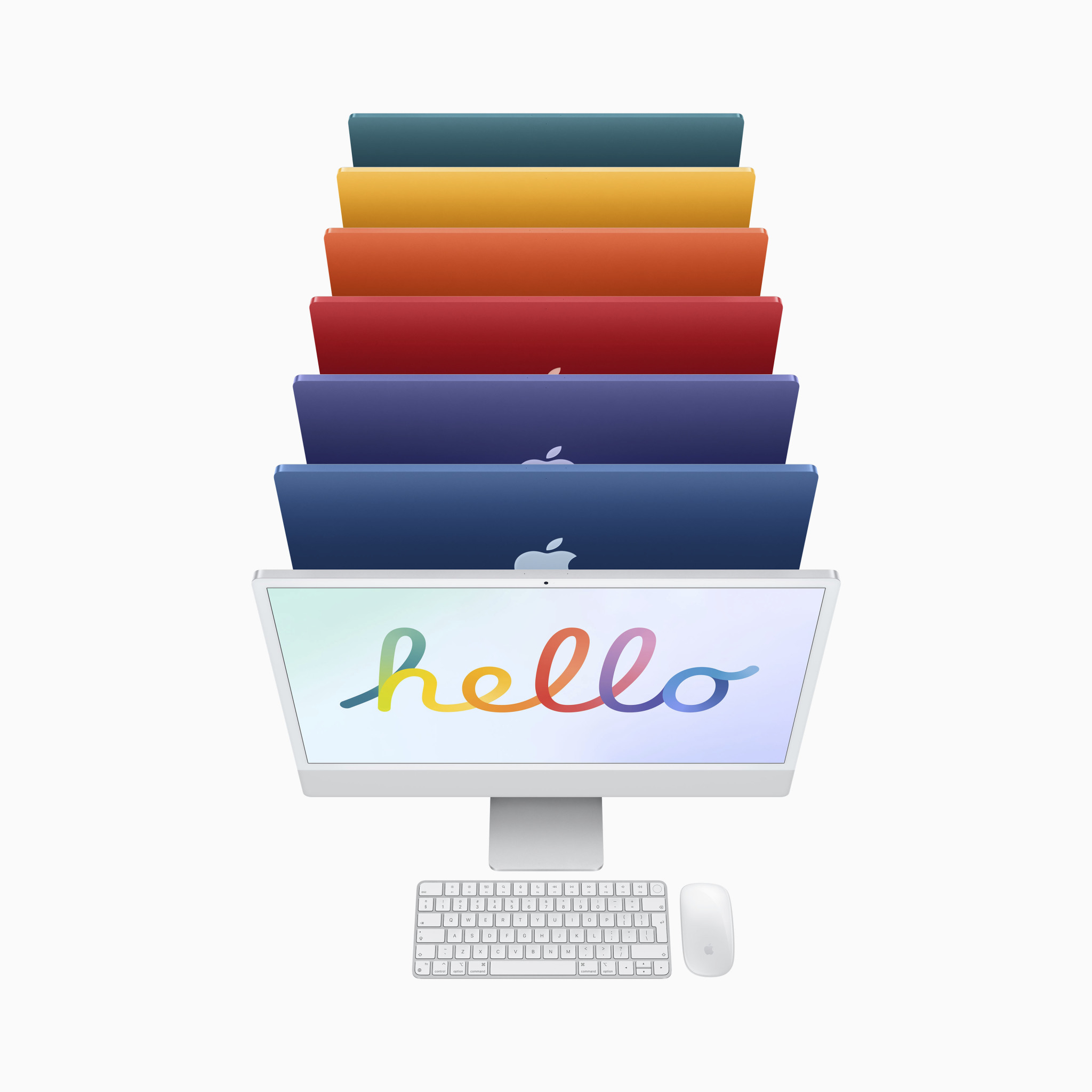 Stapel bunter iMacs, Tastatur und Maus.