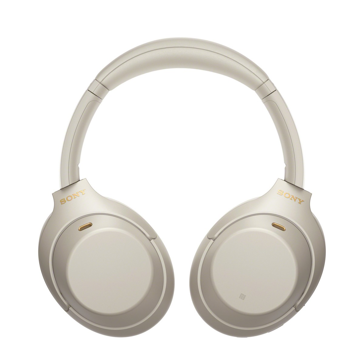 Auriculares Sony color crema. Las copas tienen el logo 'Sony'. Fondo blanco.