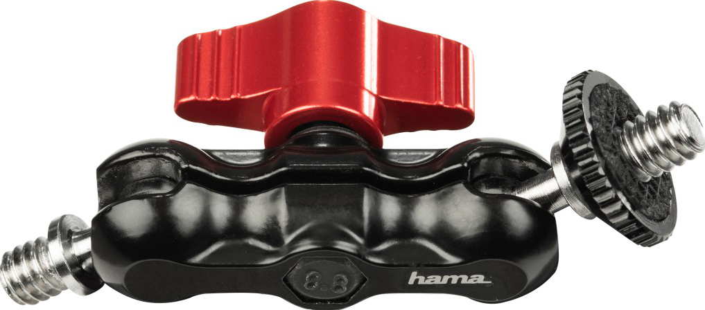 Une rotule métallique noire et rouge pour la photographie, avec des vis de chaque côté. La marque 'hama' est visible.