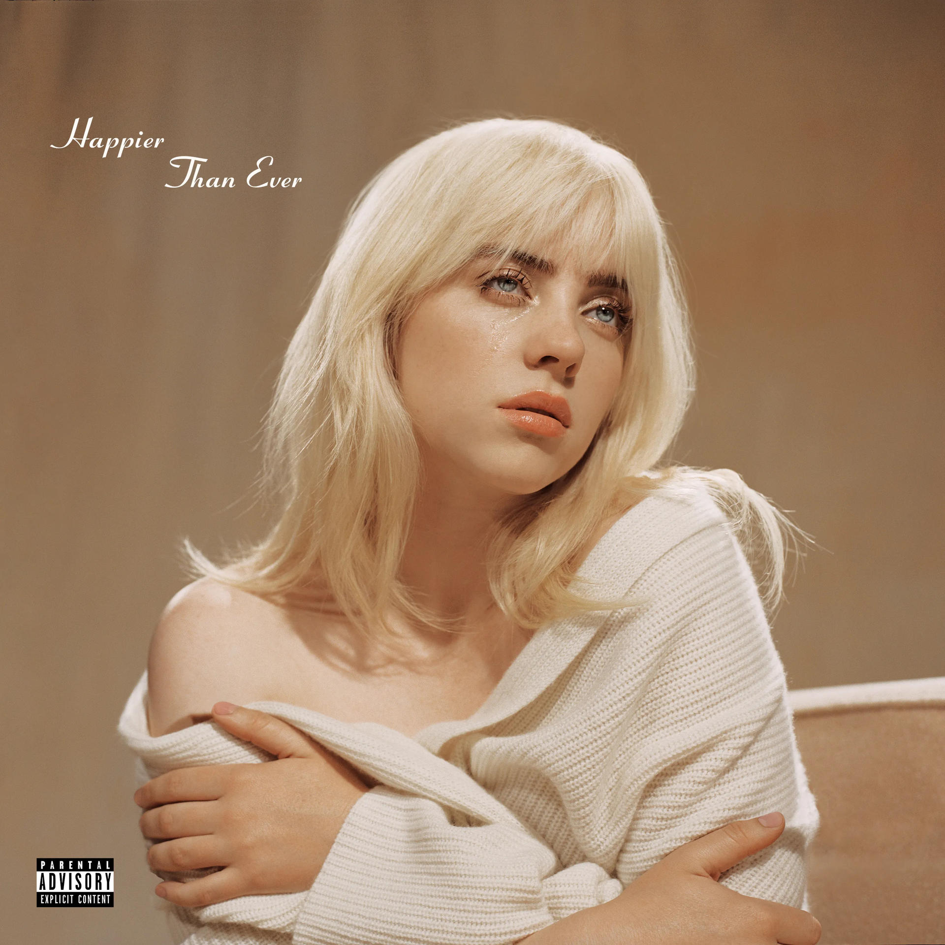 Billie Eilish met blond haar, huilend, draagt een witte trui, de titel 'Happier Than Ever'.