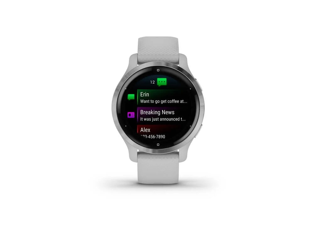 Reloj inteligente Garmin que muestra notificaciones, con una banda blanca y un diseño minimalista.