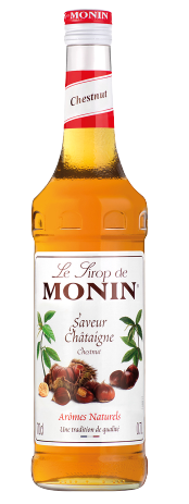Eine Monin Kastaniensirupflasche. Das Etikett hat ein Kastanien- und Blattdesign.