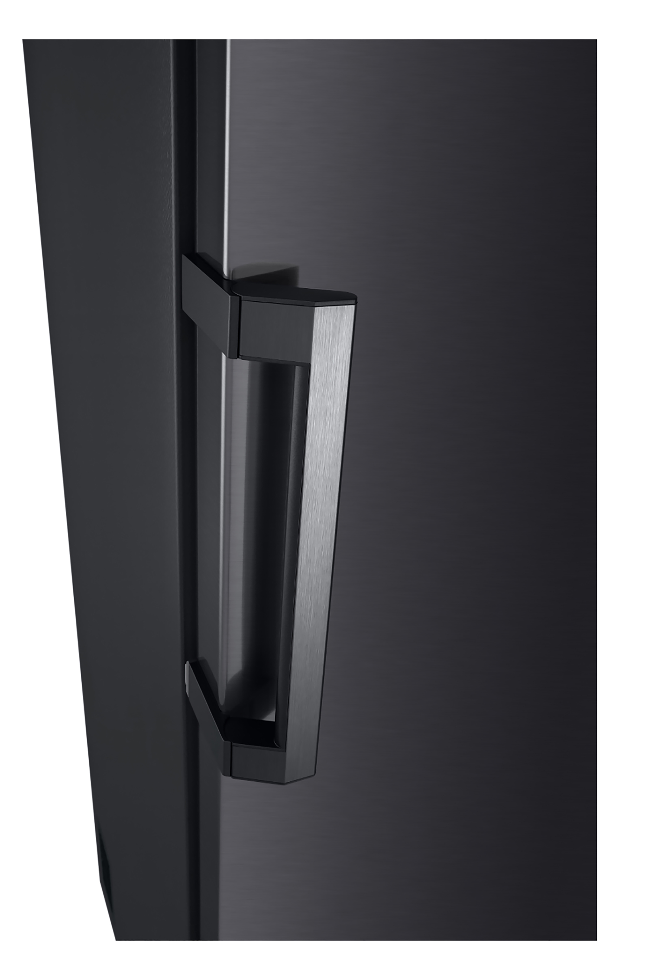Black appliance handle. A dark, rectangular handle on a black surface.