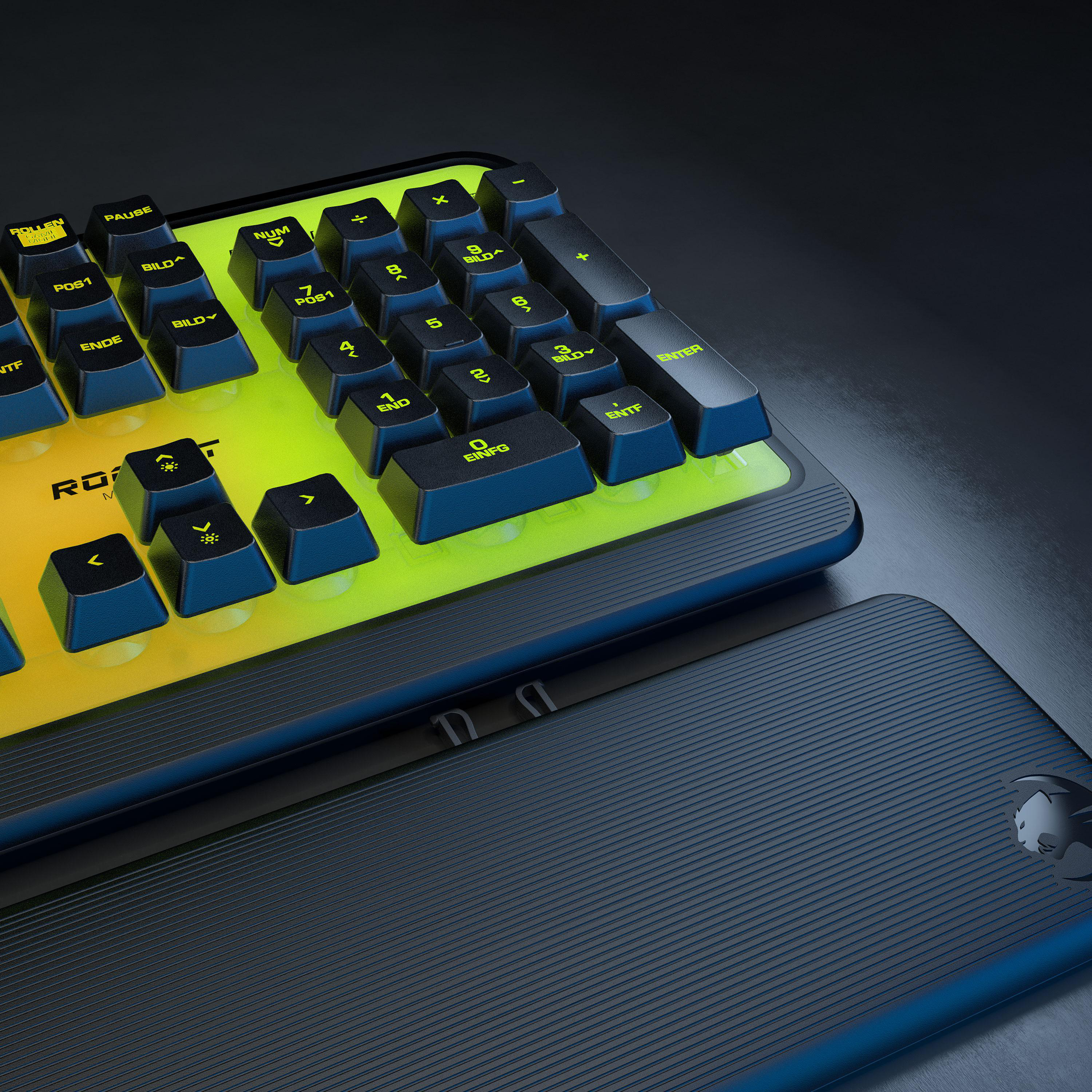 Gaming-Tastatur mit gelb-grünen Tasten. Die schwarze Rückseite ist unten. Das Layout ist sichtbar.