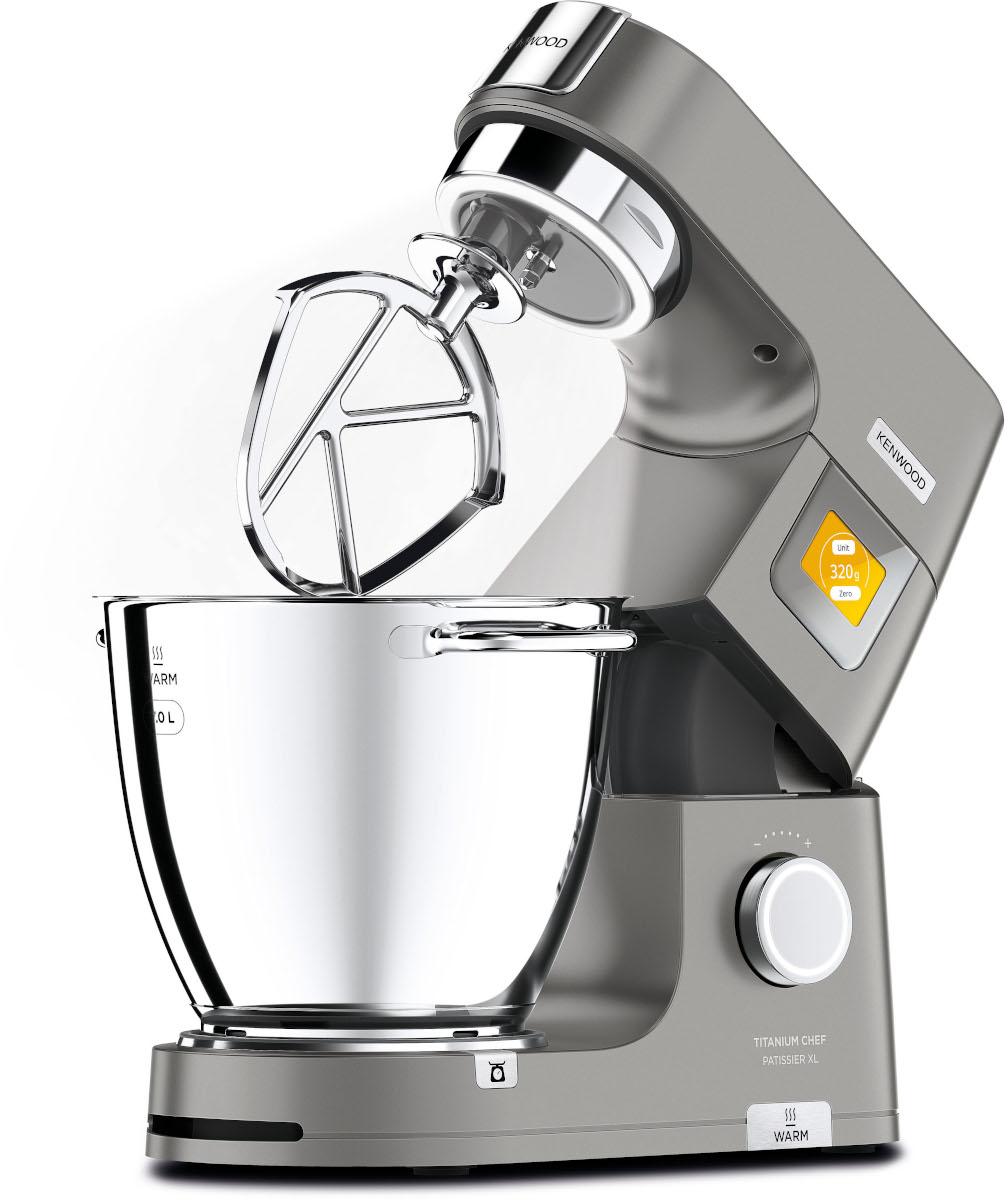 A silver Kenwood stand mixer with attachments, a bowl, and a dial for different speeds.