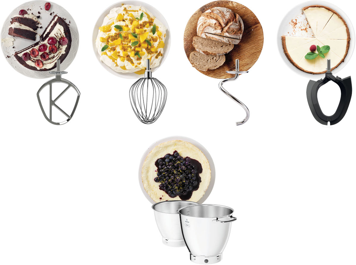 Kitchen appliance attachments, including mixer attachments and bowls, arranged on a surface.