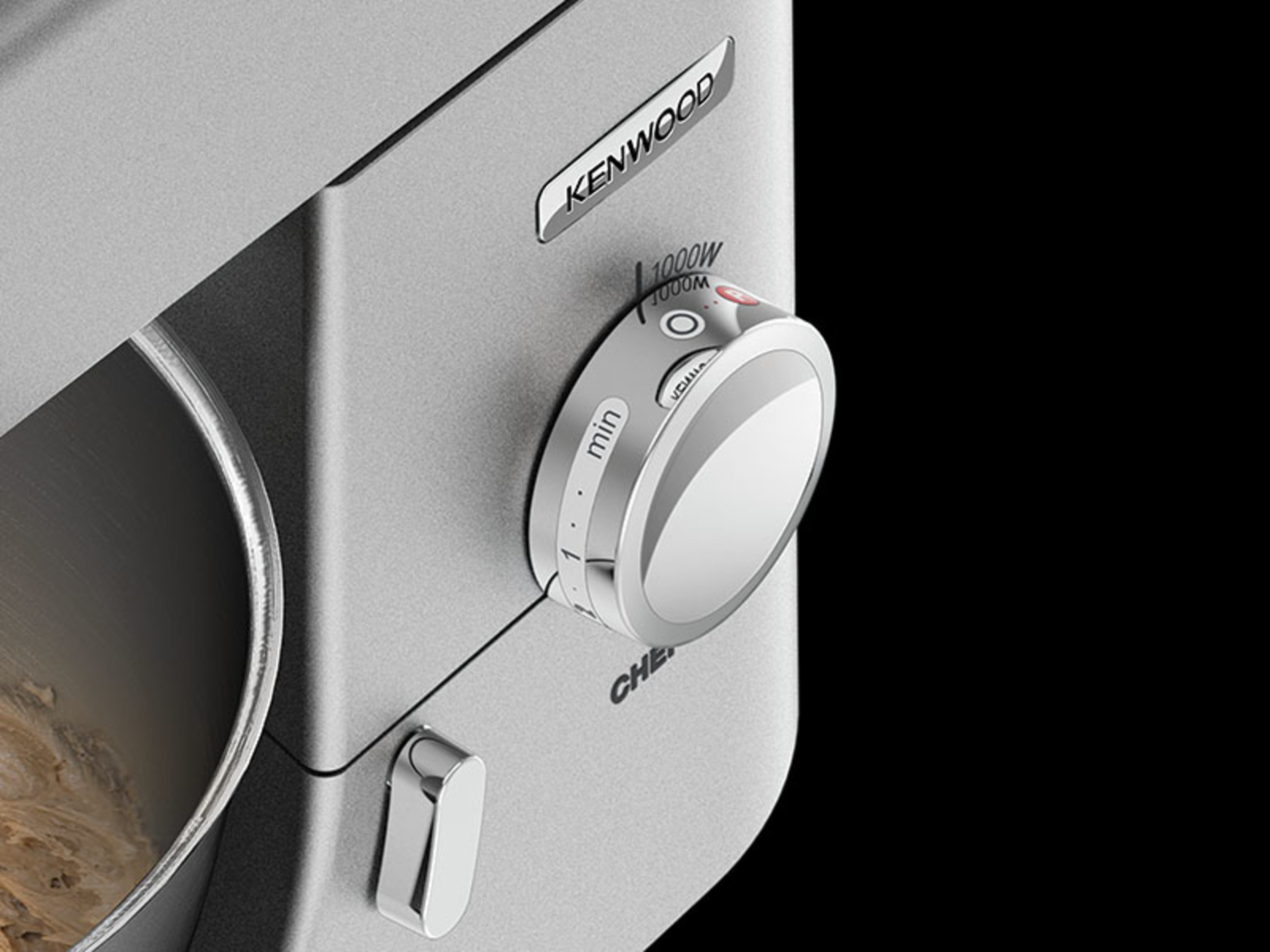 Close-up van een Kenwood Chef mixer-draaiknop, met instellingen voor vermogen en snelheid.