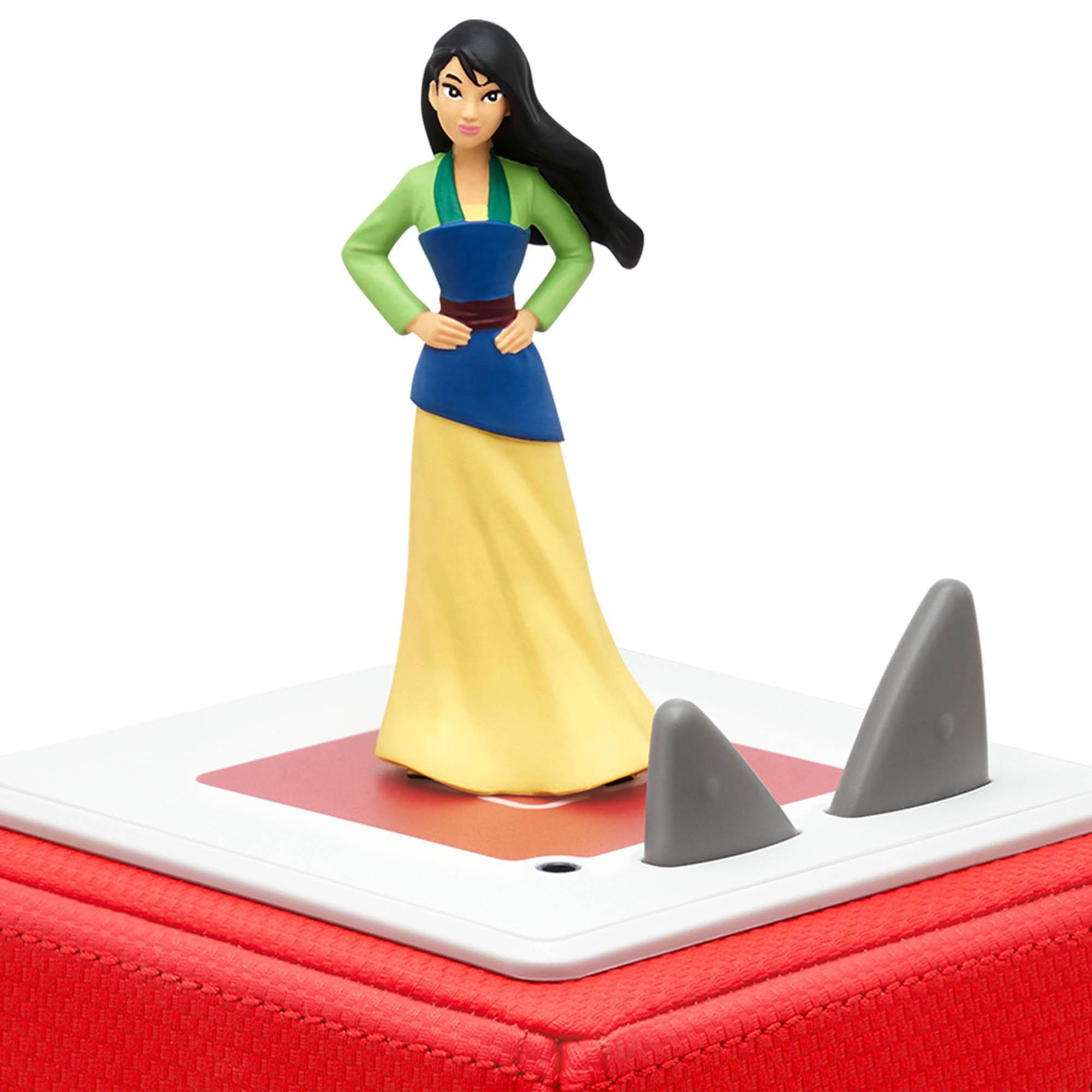 Ein Mulan-Spielzeug auf einem rot-weißen Ständer. Es hat graue Haifischflossen.