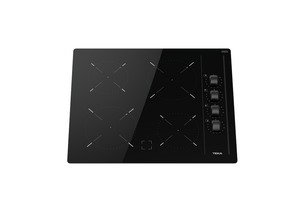 Placa de inducción Teka negra con cuatro zonas de cocción y mandos.
