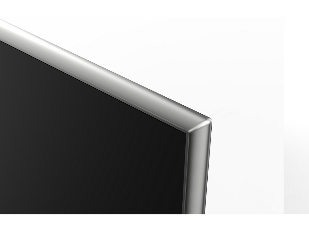 Un primer plano de la esquina de una pantalla negra con un marco plateado.
