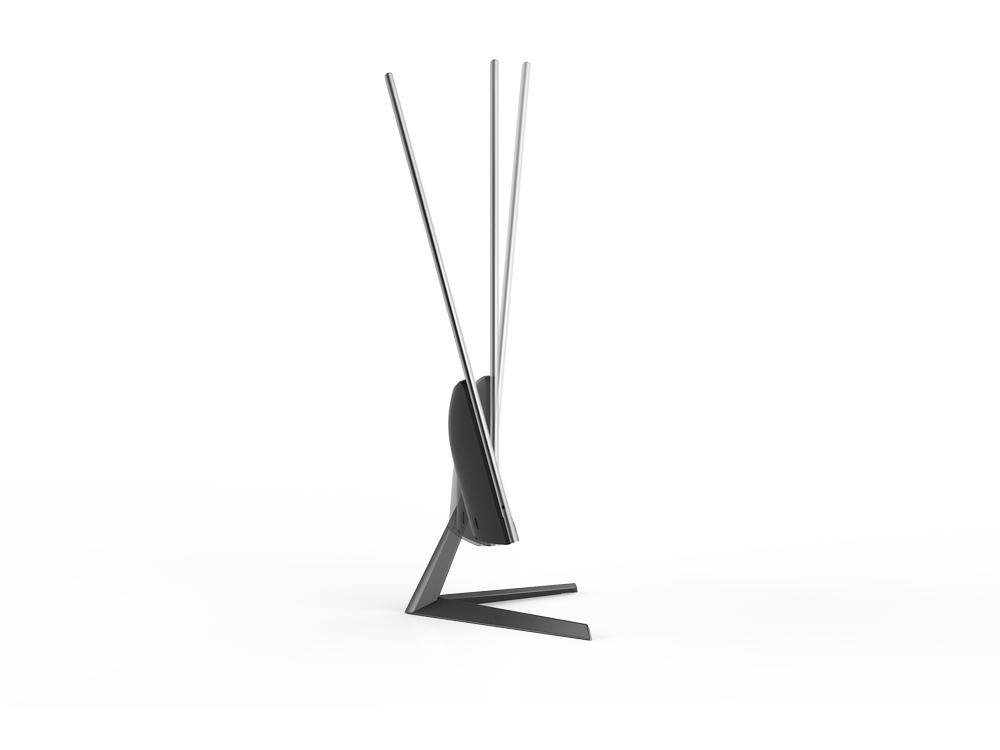Un monitor de computadora negro se curva sobre una superficie blanca.