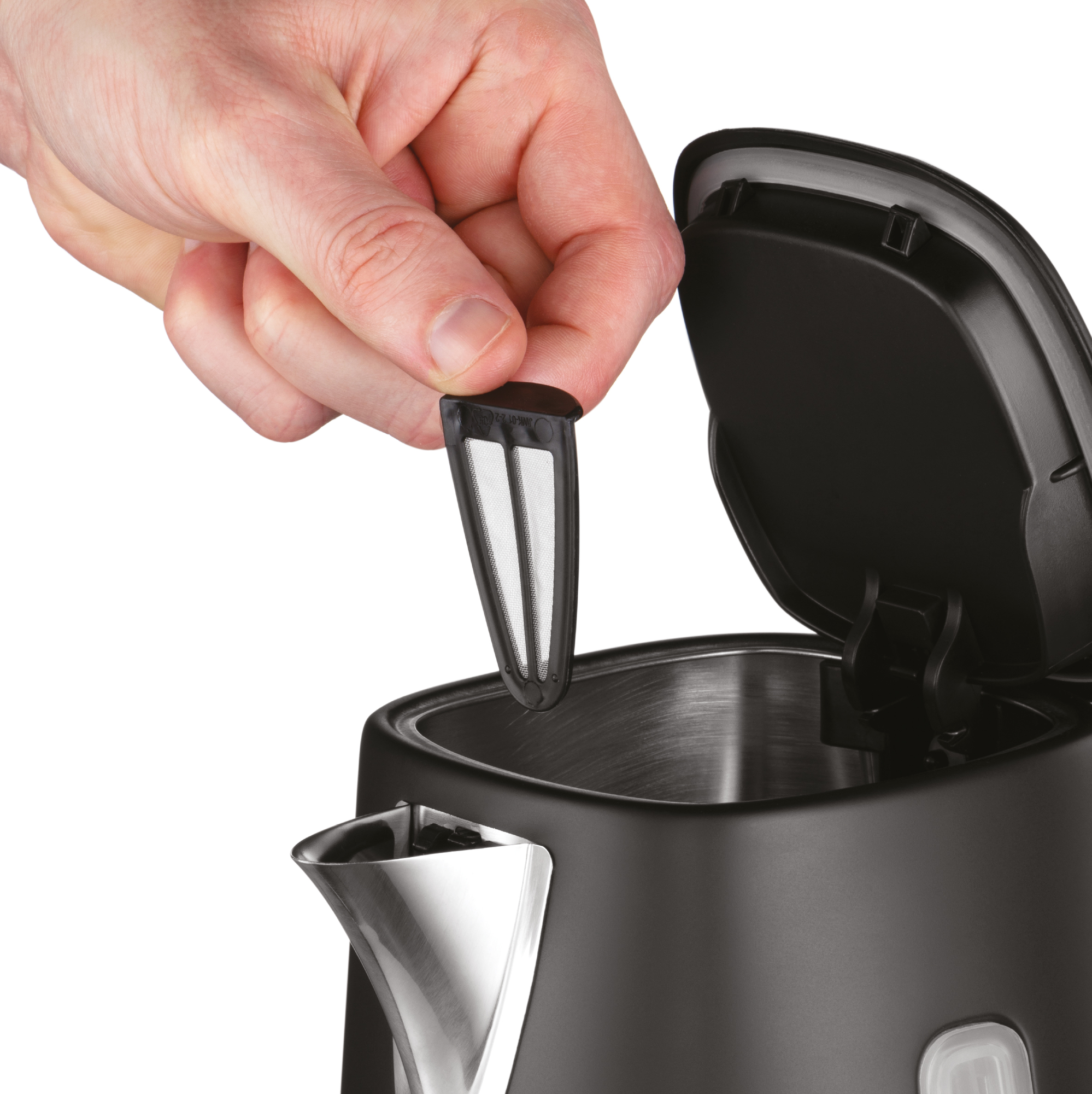 Hand removes a filter from a black kettle with the lid open, close-up shot.