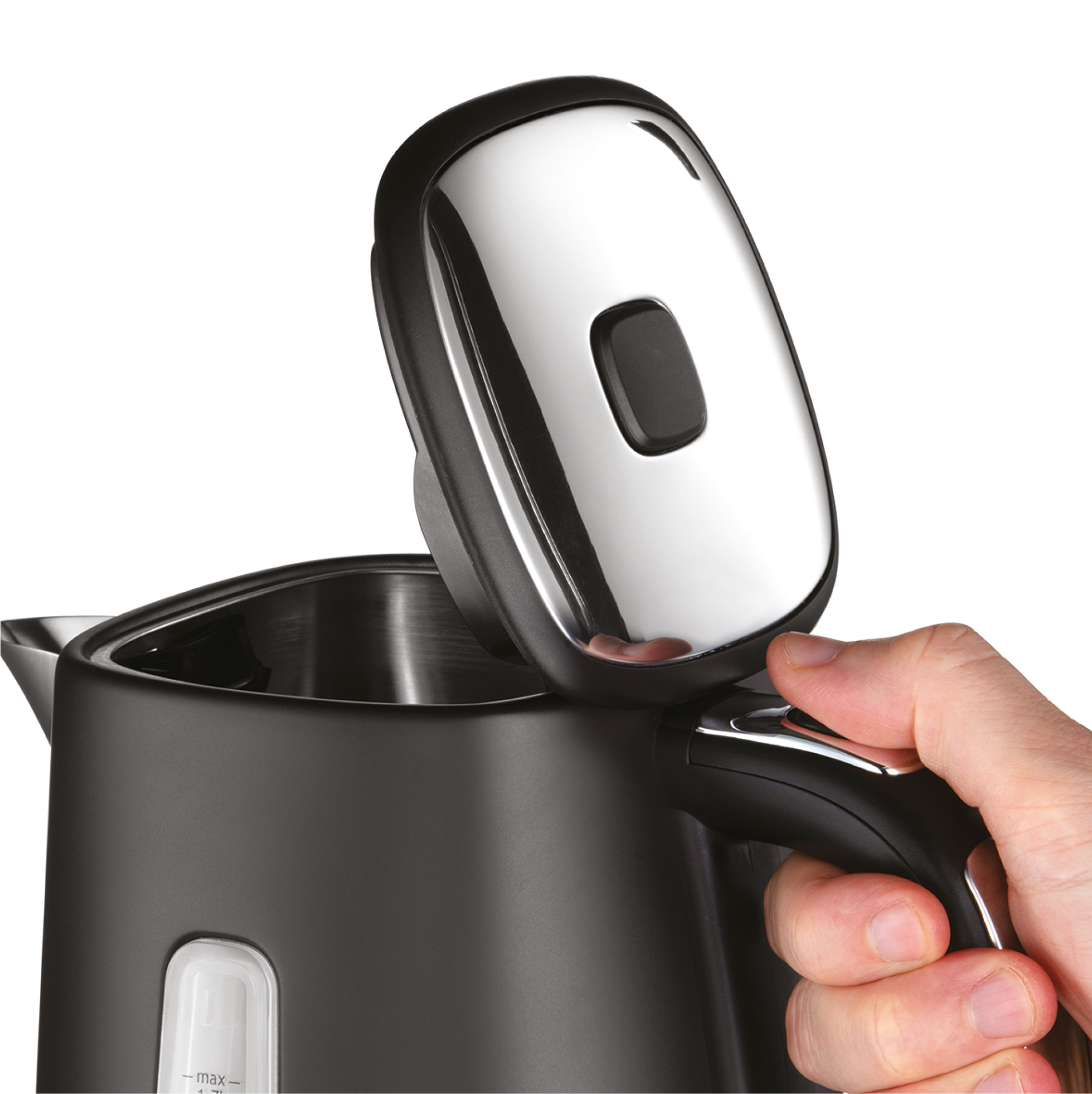 A hand opening the lid of a black and silver electric kettle.