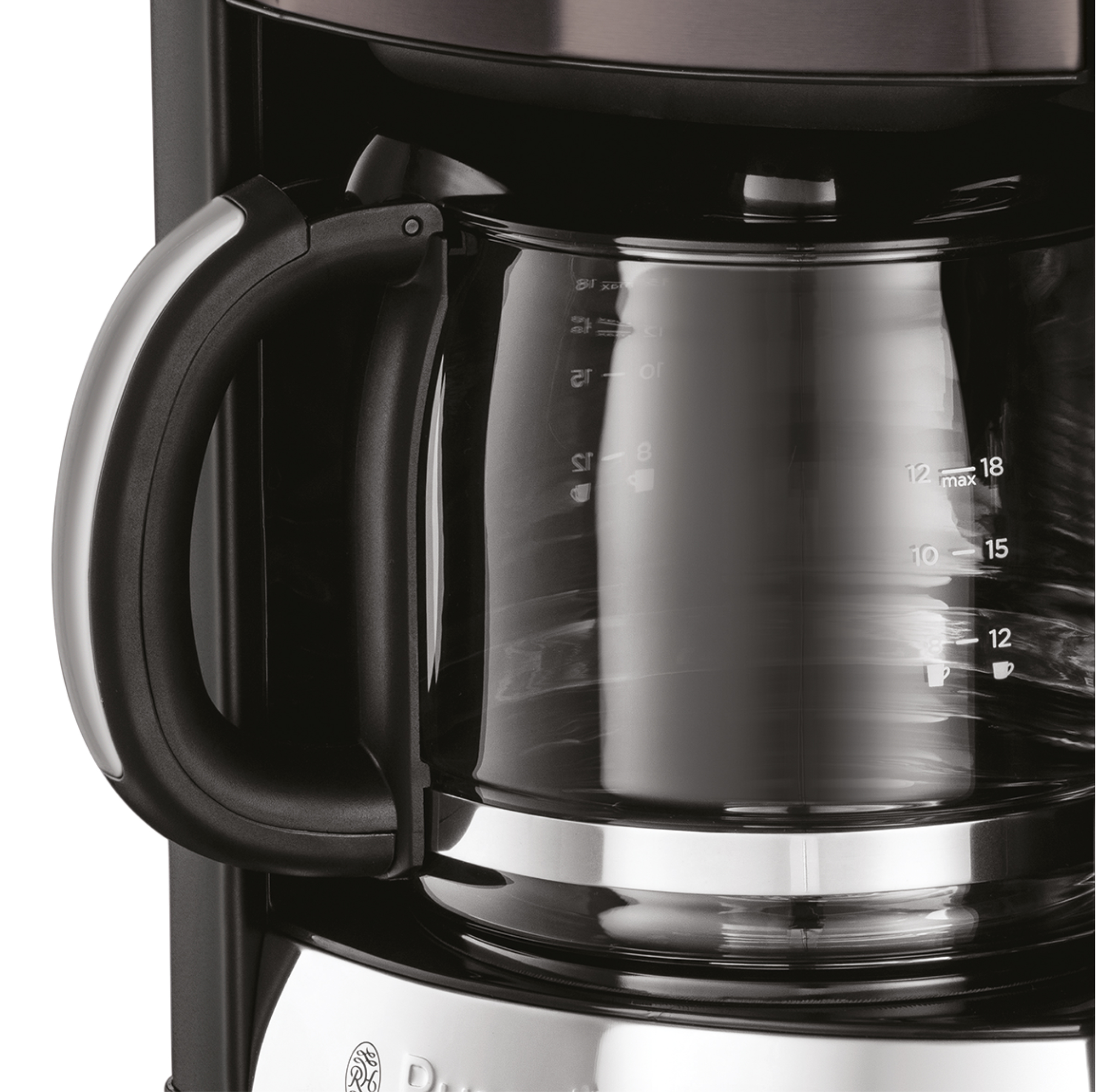 A close-up of a glass coffee pot and a black coffeemaker.