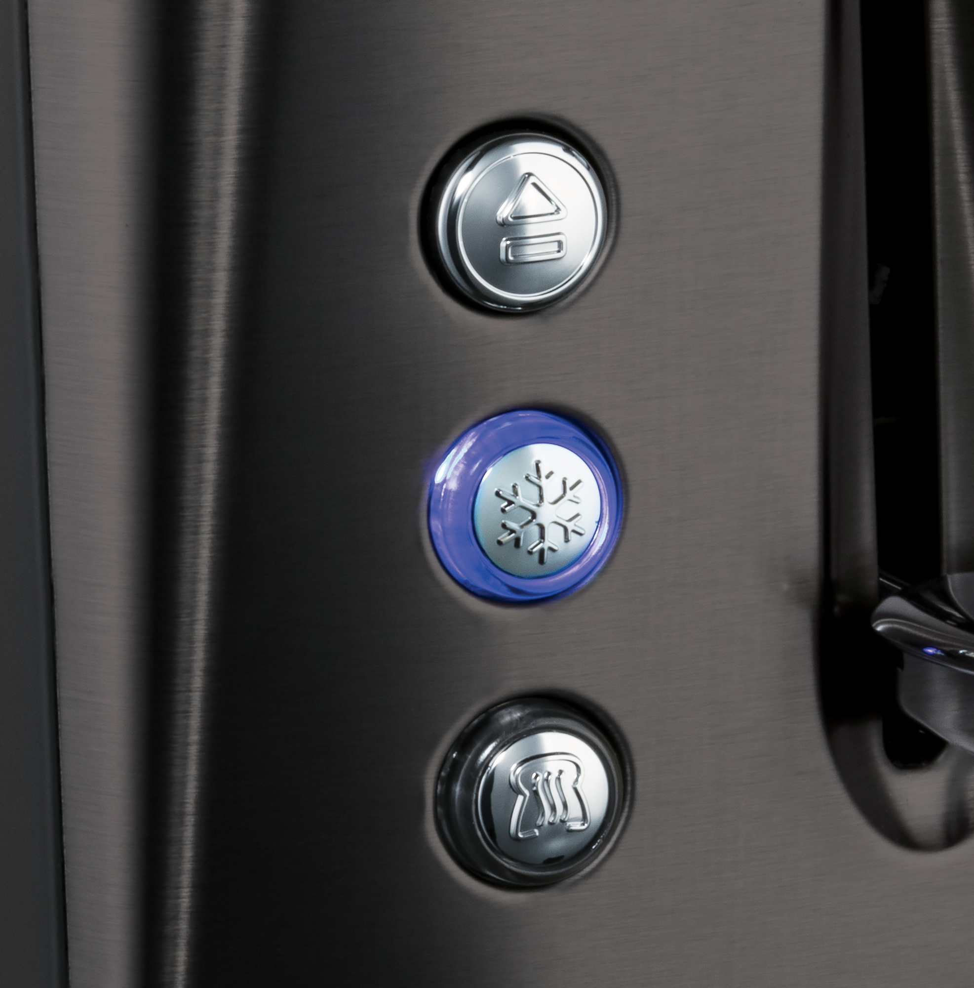 Close-up of a toaster with buttons for various functions.
