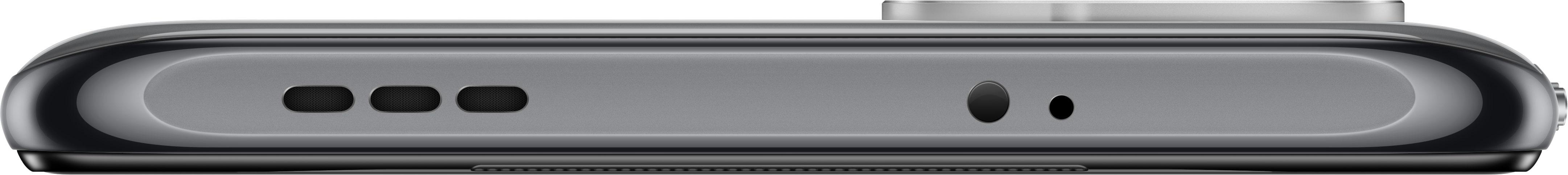Die Unterkante eines grauen Smartphones mit Ladeanschluss, Mikrofon und Lautsprecher.