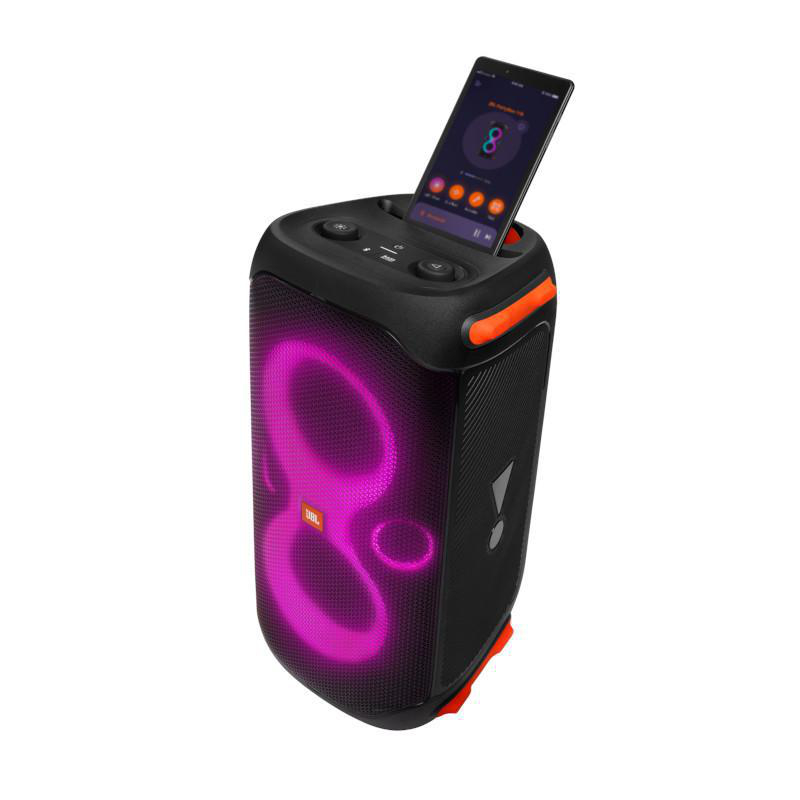 Schwarzer JBL-Lautsprecher mit rosa Licht, ein Smartphone spielt Musik auf dem Lautsprecher.