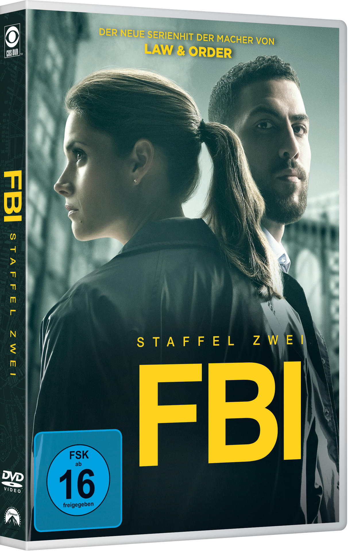 DVD-Cover der FBI-Serie. Zwei Schauspieler, ein Mann und eine Frau, vor einer Stadtansicht.