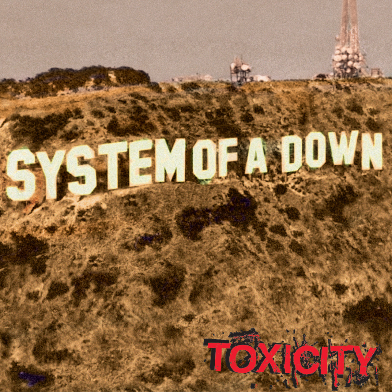 A Hollywood felirat, SYSTEM OF A DOWN-ra átalakítva. A Toxicity szó alul található.