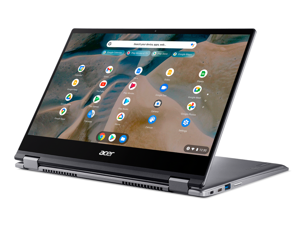 Portátil plateado abierto, mostrando un navegador con iconos de aplicaciones. Logo Acer visible.