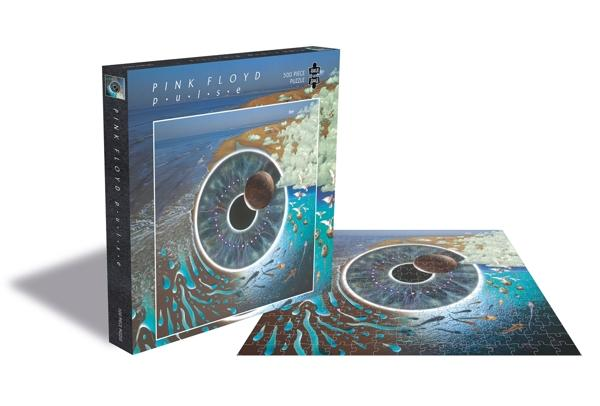 Pink Floyd kirakós doboz és kirakós. A kirakós egy szemet és egy űrbéli jelenetet mutat. Árnyék vetül.