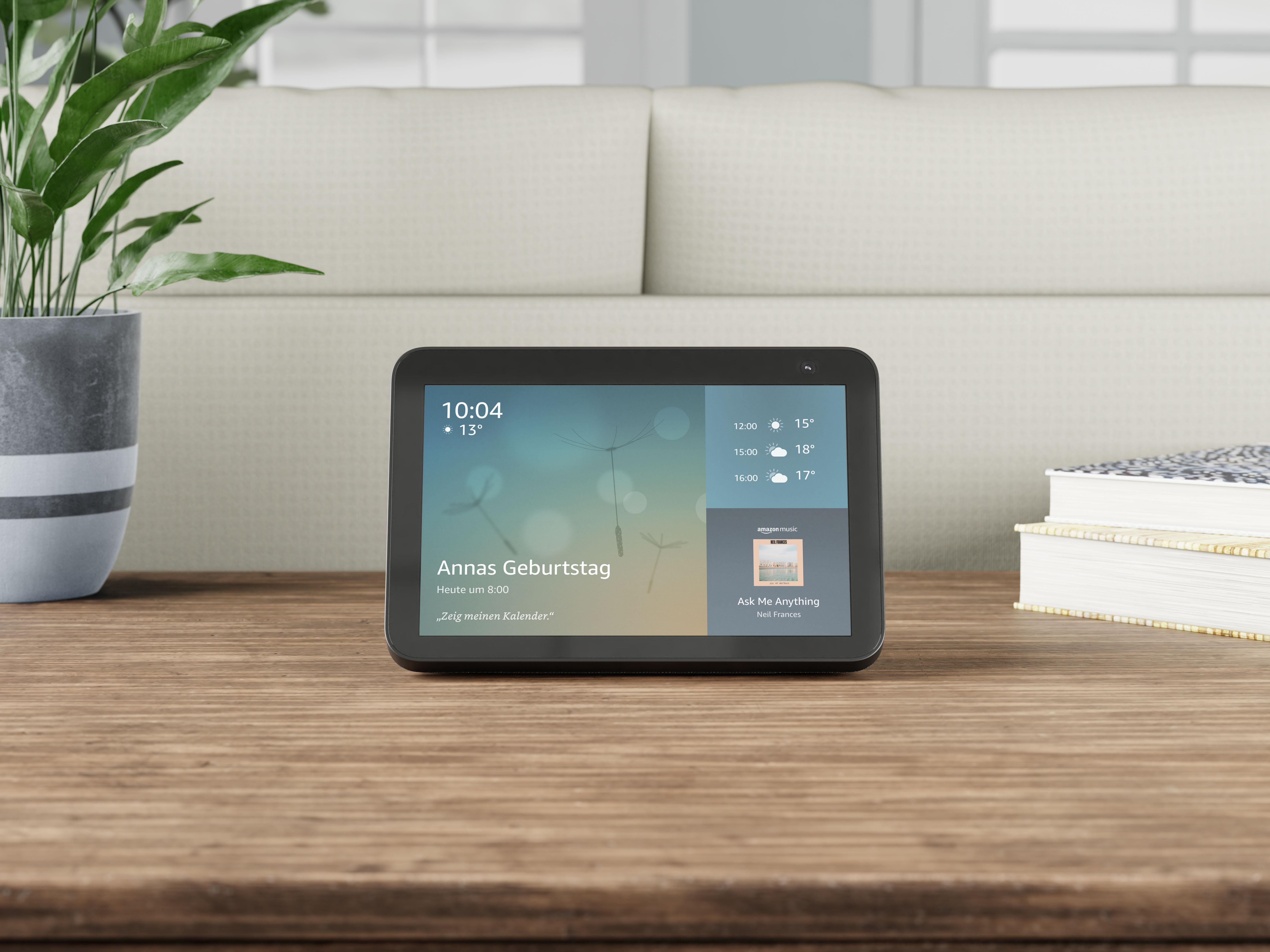 Ein Smart-Display auf einem Holztisch mit unscharfem Hintergrund.