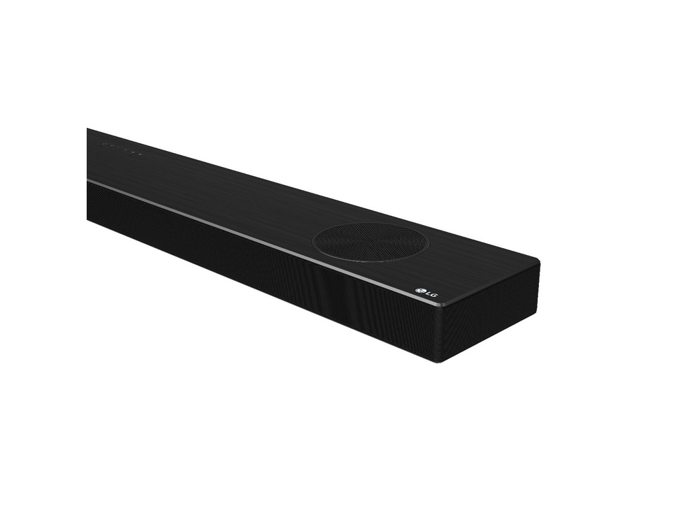Barra de sonido LG negra. Tiene un altavoz redondo en el centro y el logotipo de LG.