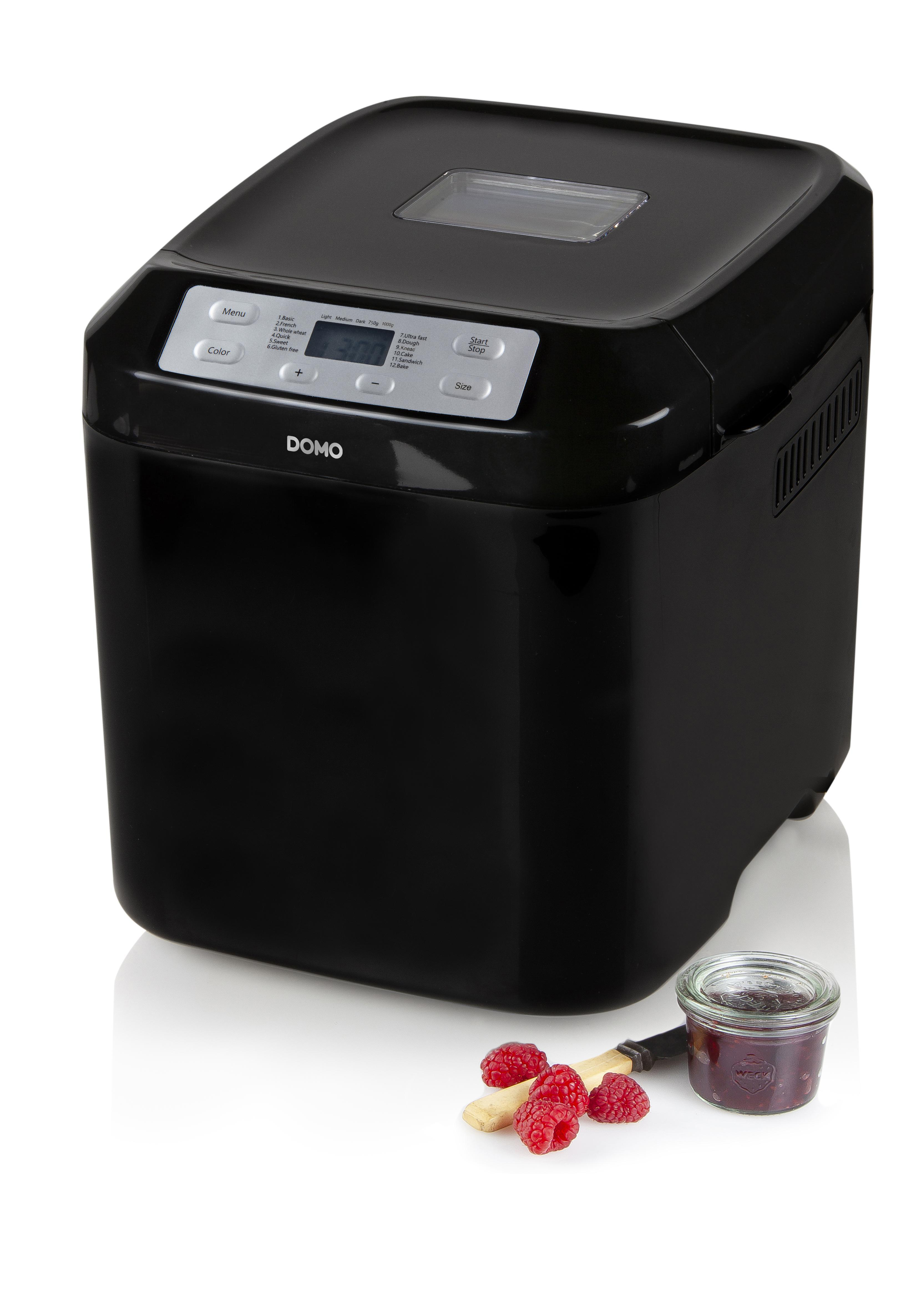 Schwarzer Brotbackautomat mit Himbeeren und Marmelade. Bedienelemente oben, Seitenprofil.