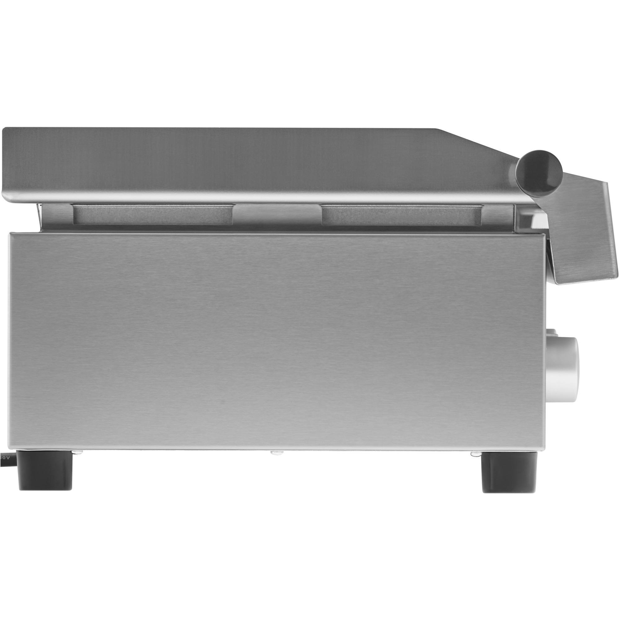 Ein graues Metallgerät, wahrscheinlich eine Küchenmaschine oder ähnliches, von der Seite gesehen.