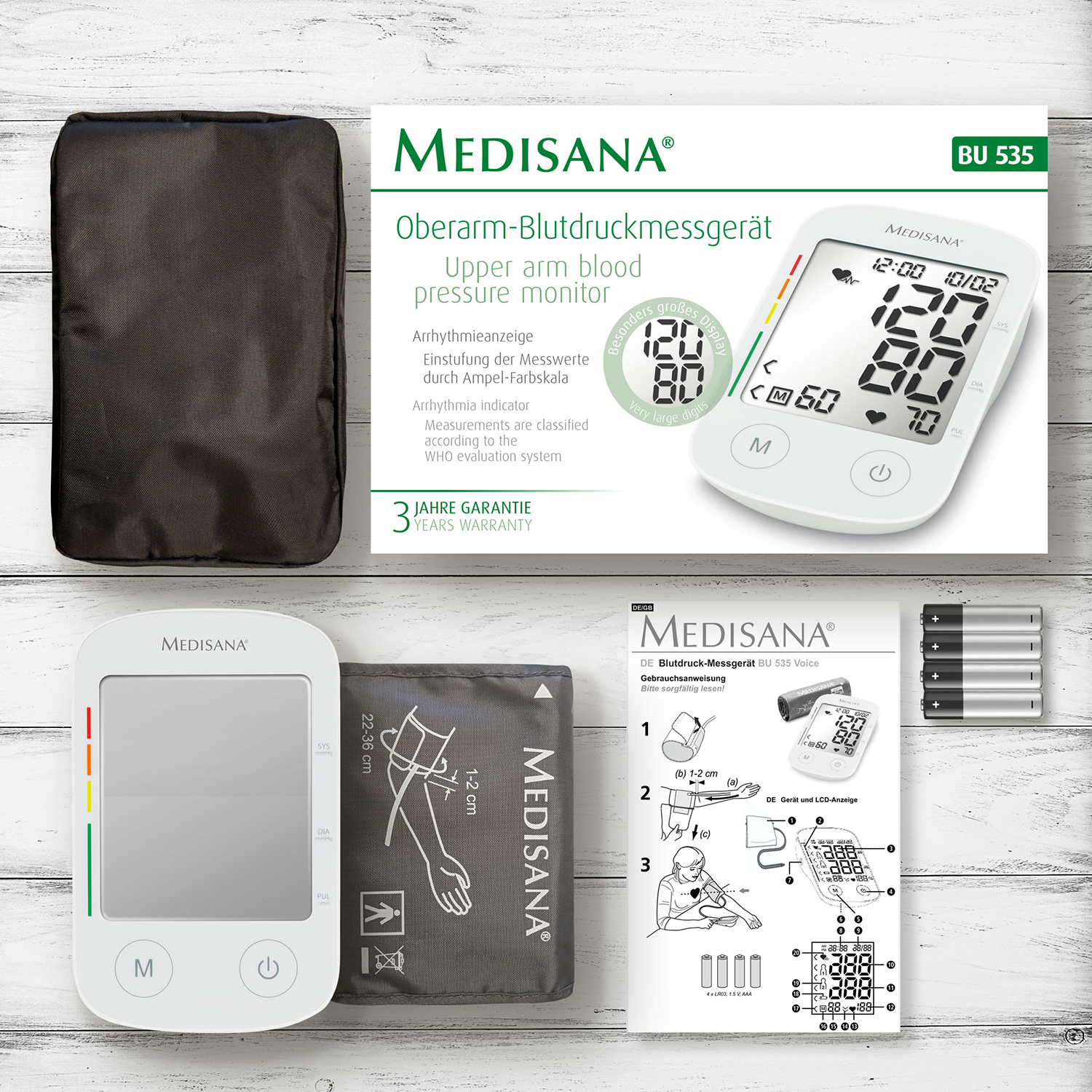 Bloeddrukmonitor kit met monitor, manchet, tas en instructies.