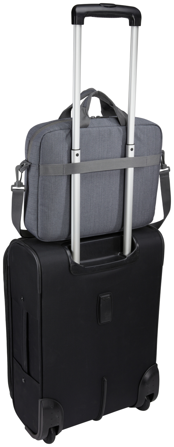 A gray laptop bag is on top of a black rolling suitcase. The suitcase handle is extended.
