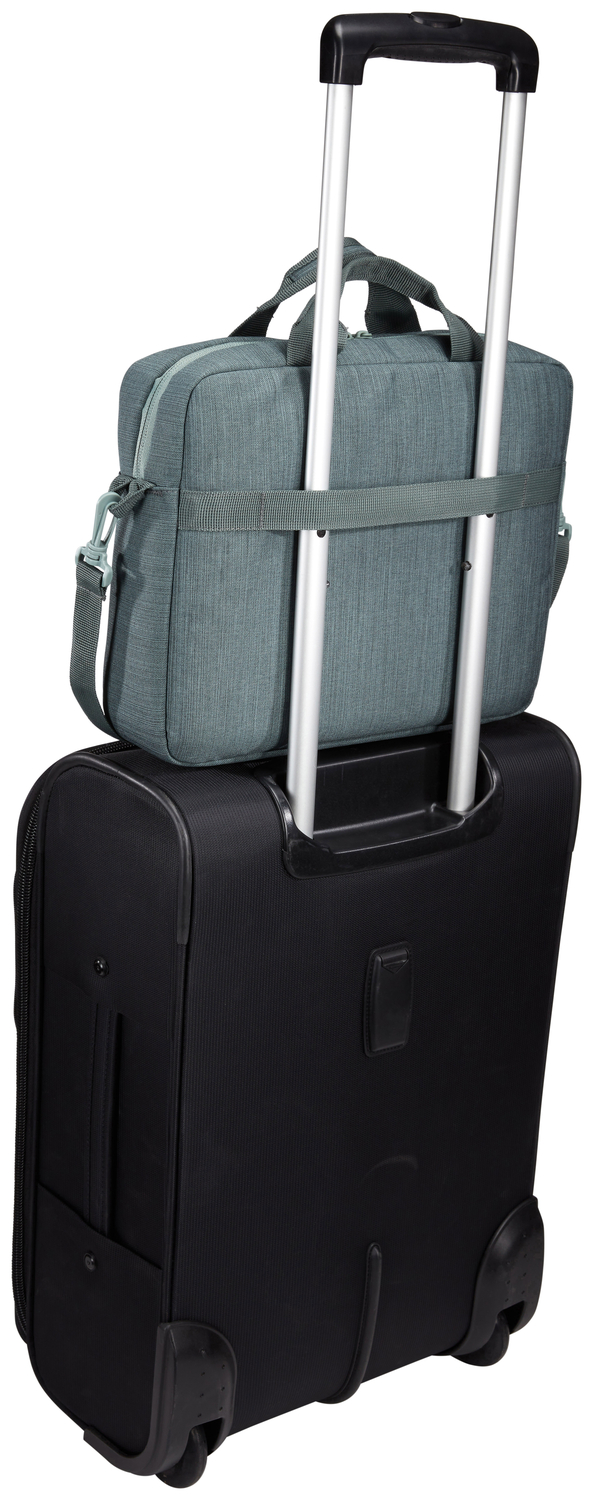 A black suitcase with a grey bag on top. The bag is attached to the suitcase handle.