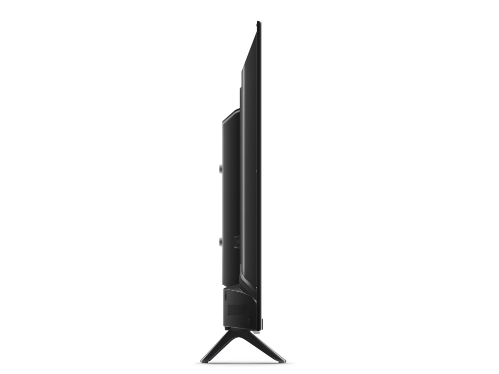 Vista lateral de un televisor negro y elegante. La pantalla está apagada, sobre un soporte.