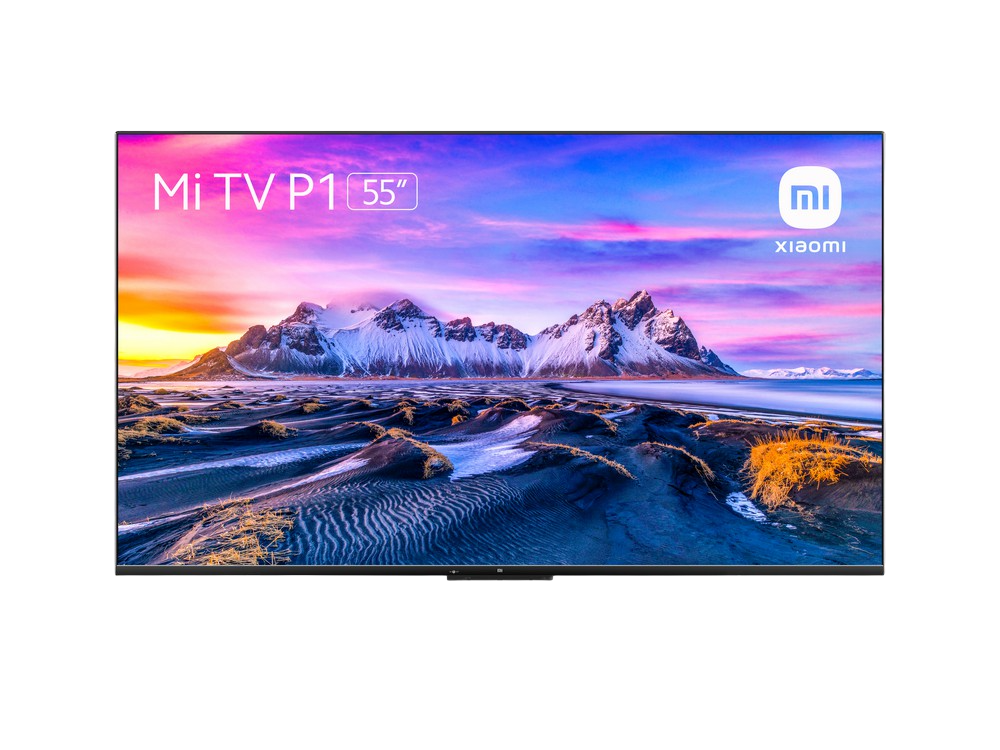 Mi TV P1 de 55 pulgadas sobre fondo negro. Vista de atardecer colorida.