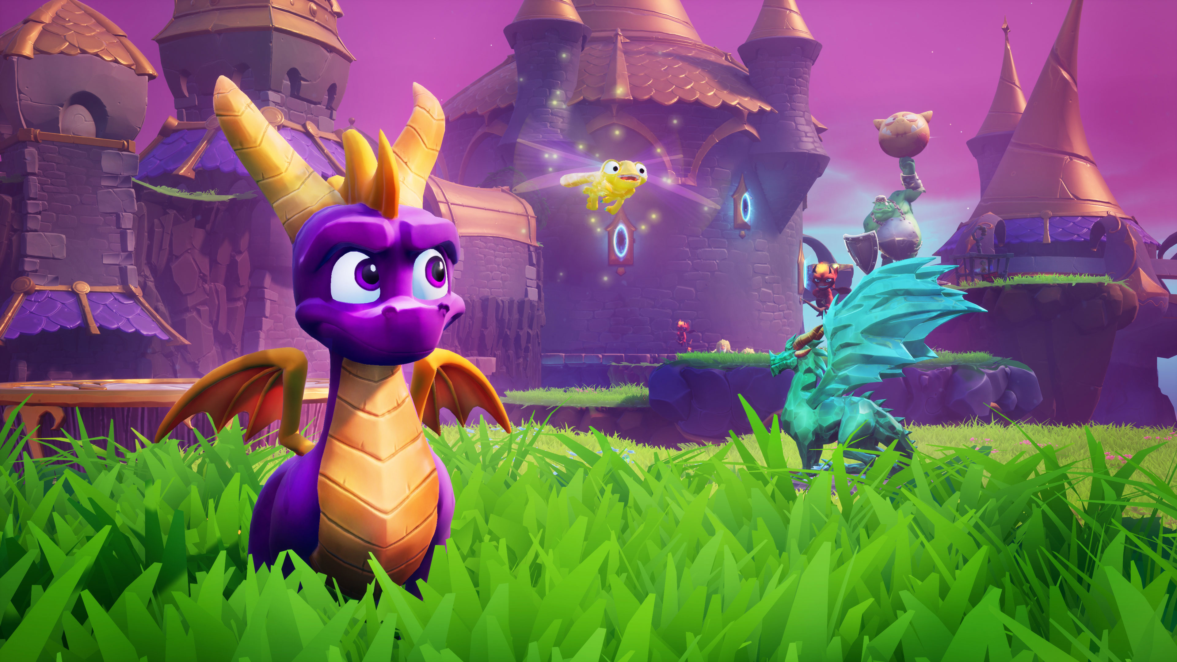 Spyro il drago è nell'erba, con un drago cartoonesco e una creatura volante sullo sfondo.