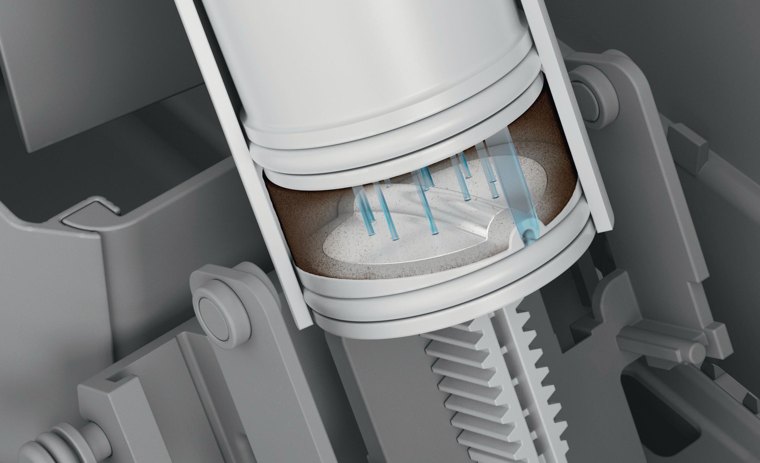 Eine Schnittansicht einer mechanischen Komponente, die Innenteile zeigt. Blaue Rohre gehen in einen weißen Zylinder.