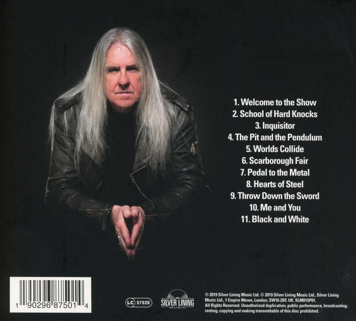 Albumcover mit einem Mann. Text listet die Songs auf dem Album auf.