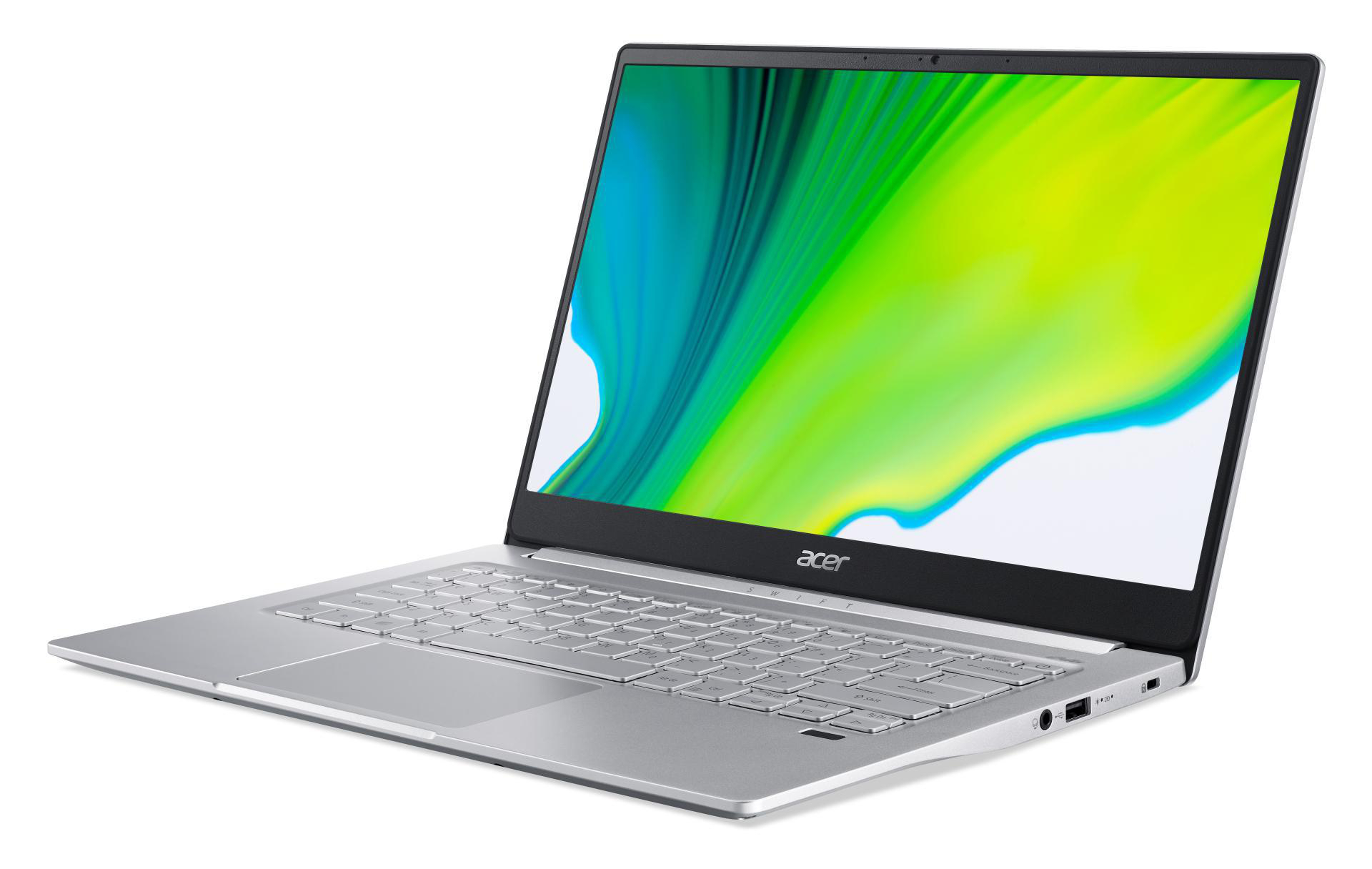 Ein silberner Laptop auf weißem Untergrund, zeigt ein abstraktes grün-gelbes Bild auf dem Bildschirm.