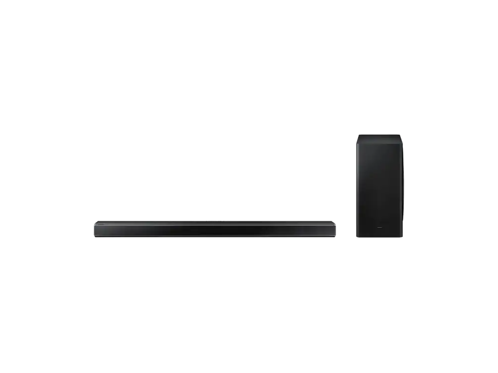 Barra de sonido y subwoofer negros sobre fondo negro.