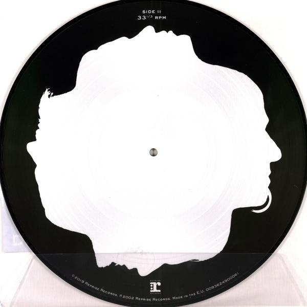 Schwarze Schallplatte mit weißen Silhouetten von zwei Gesichtern, die sich gegenüberstehen.