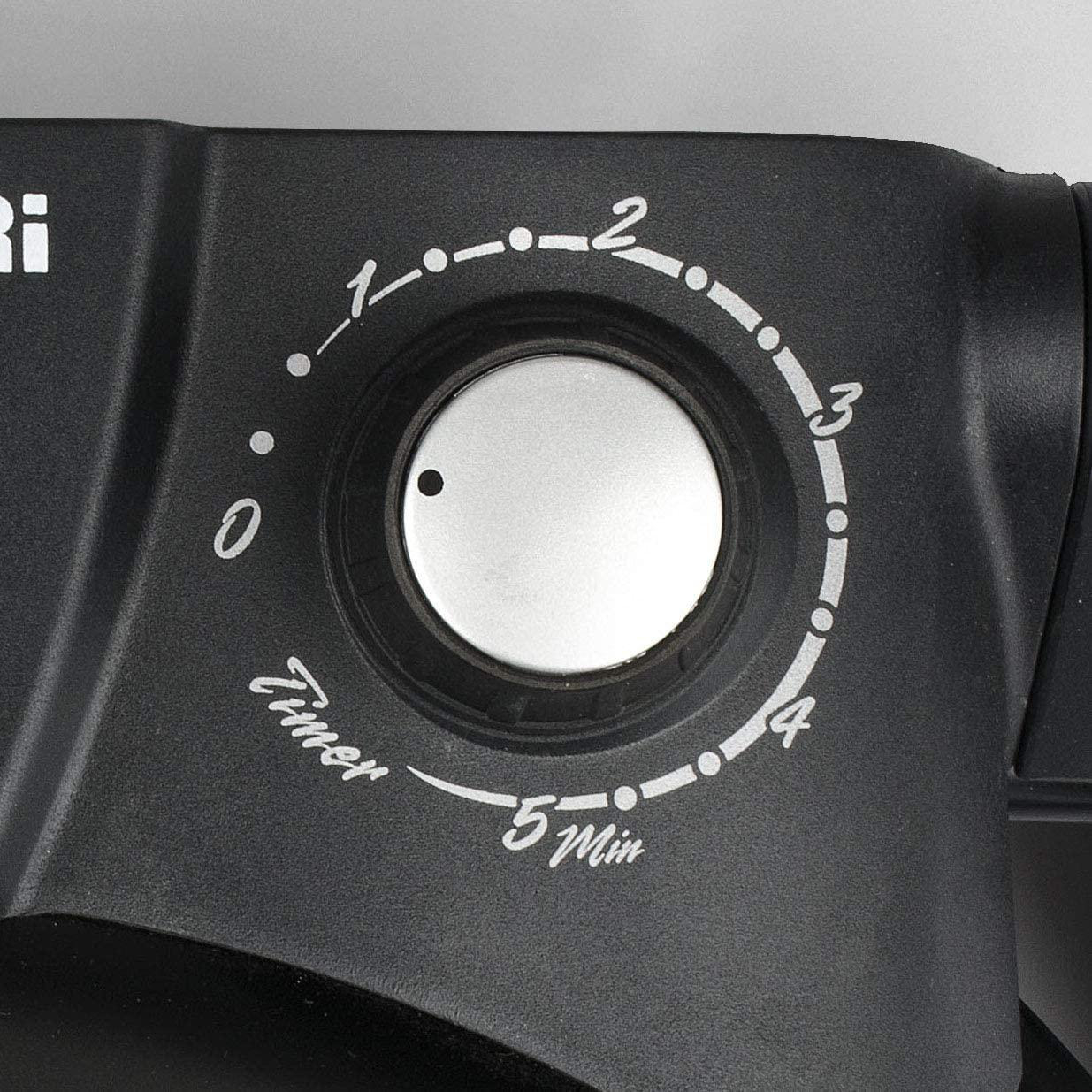 Ein Timer-Drehknopf an einem schwarzen Gerät. Zahlen von 0 bis 5 mit silbernem Knopf.