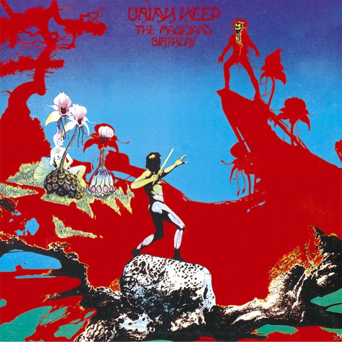 Album borító. Piros táj alakokkal és virágokkal. Cím: The Magician's Birthday, előadó: Uriah Heep.