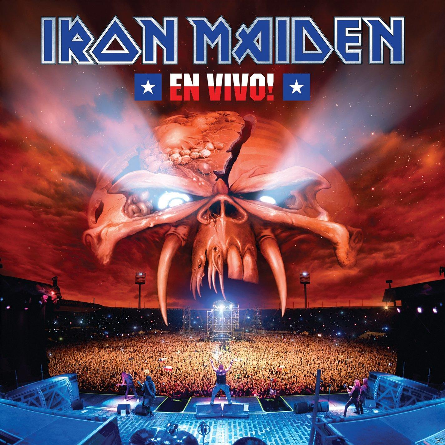 Az Iron Maiden album borítója, 'En Vivo!' címmel, egy koponyával a koncertközönség felett, tüzes háttérrel.