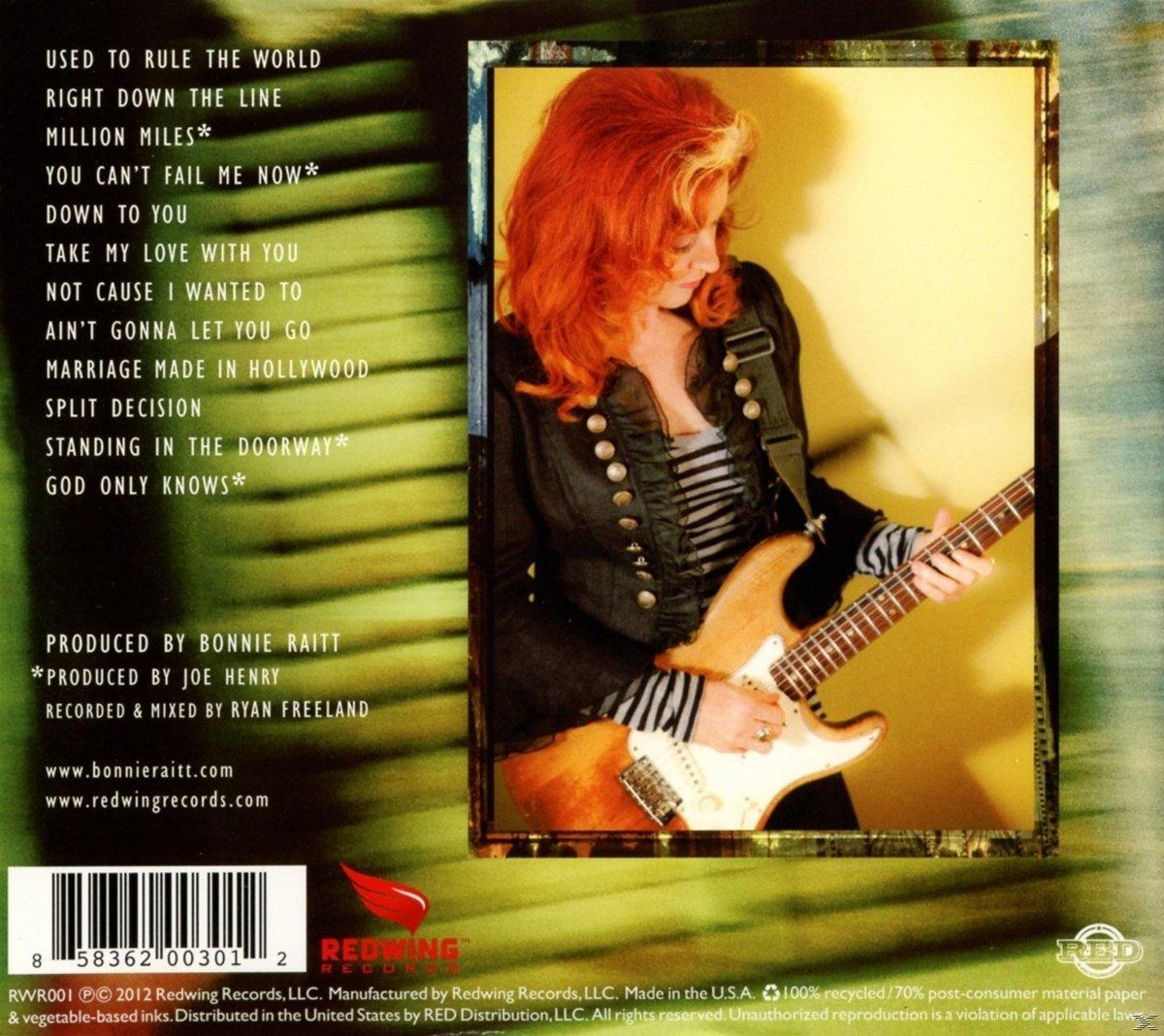 Frau mit roten Haaren spielt braune Gitarre. Albumcover mit Songtiteln und Credits.