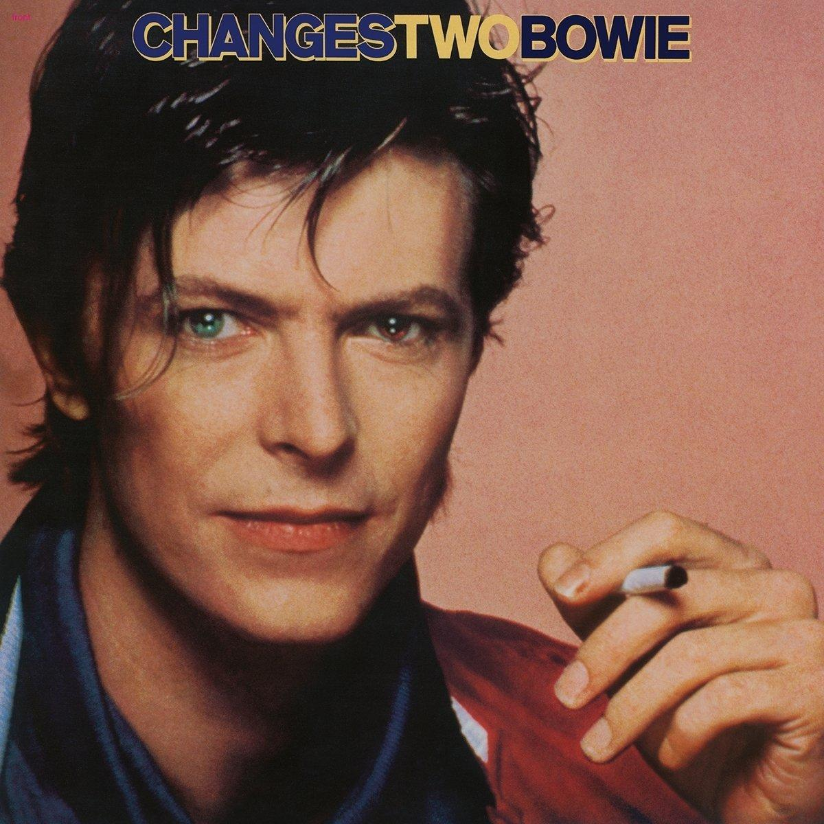 David Bowie album cover. Close-up of face, one green eye, one brown, with cigarette. Text 'CHANGES TWO BOWIE'.