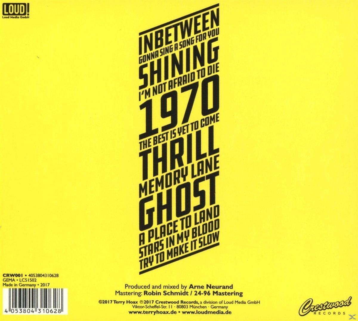 Albumcover mit fettem Text und gelbem Hintergrund mit dem Wort GHOST.