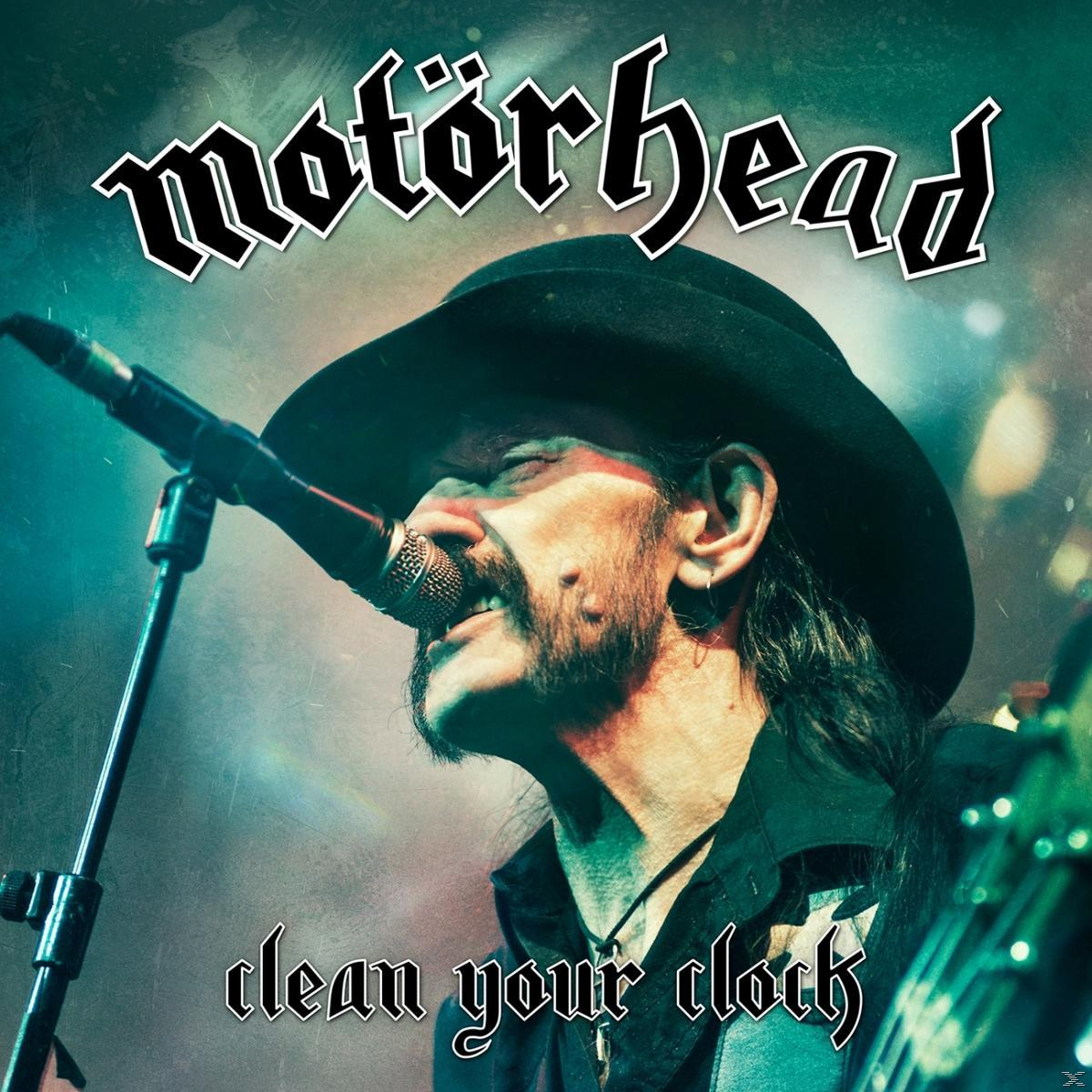 Motörhead album borító Lemmyvel, amint mikrofonba énekel, türkiz és zöld háttéren.