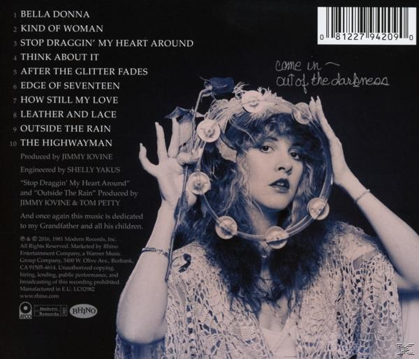 Albumcover mit einer Frau mit Blumenschmuck. Der Hintergrund ist eine Mischung aus Farben. Text ist vorhanden.