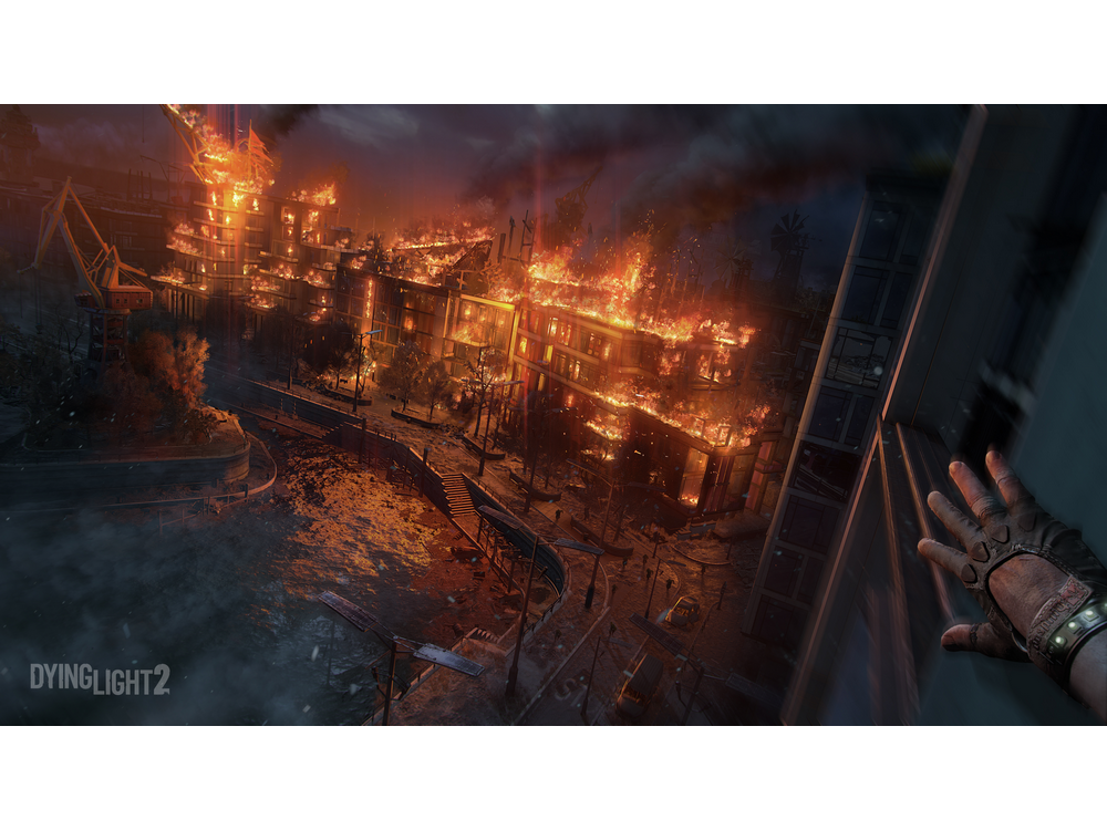 Una ciudad en llamas con una mano extendida y el logo de Dying Light 2.